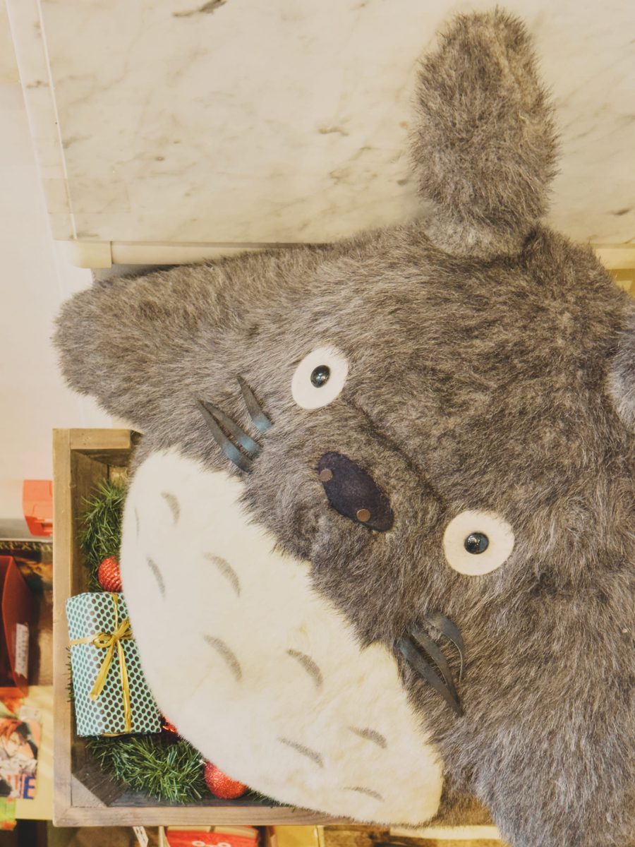 A giant plushie of Totoro in a Japanese bookshop.