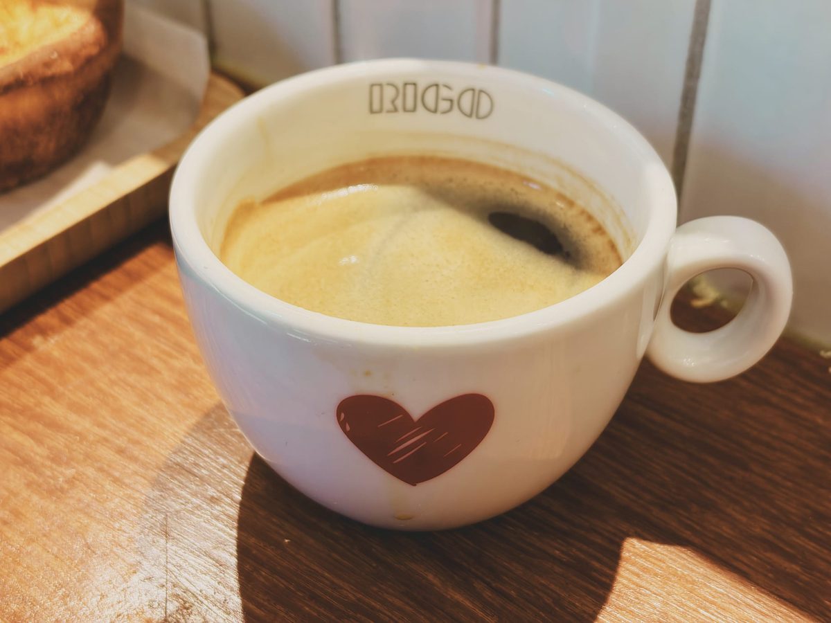 A small coffee cup stamped with a red heart. Image Anthony Nelzin-Santos.