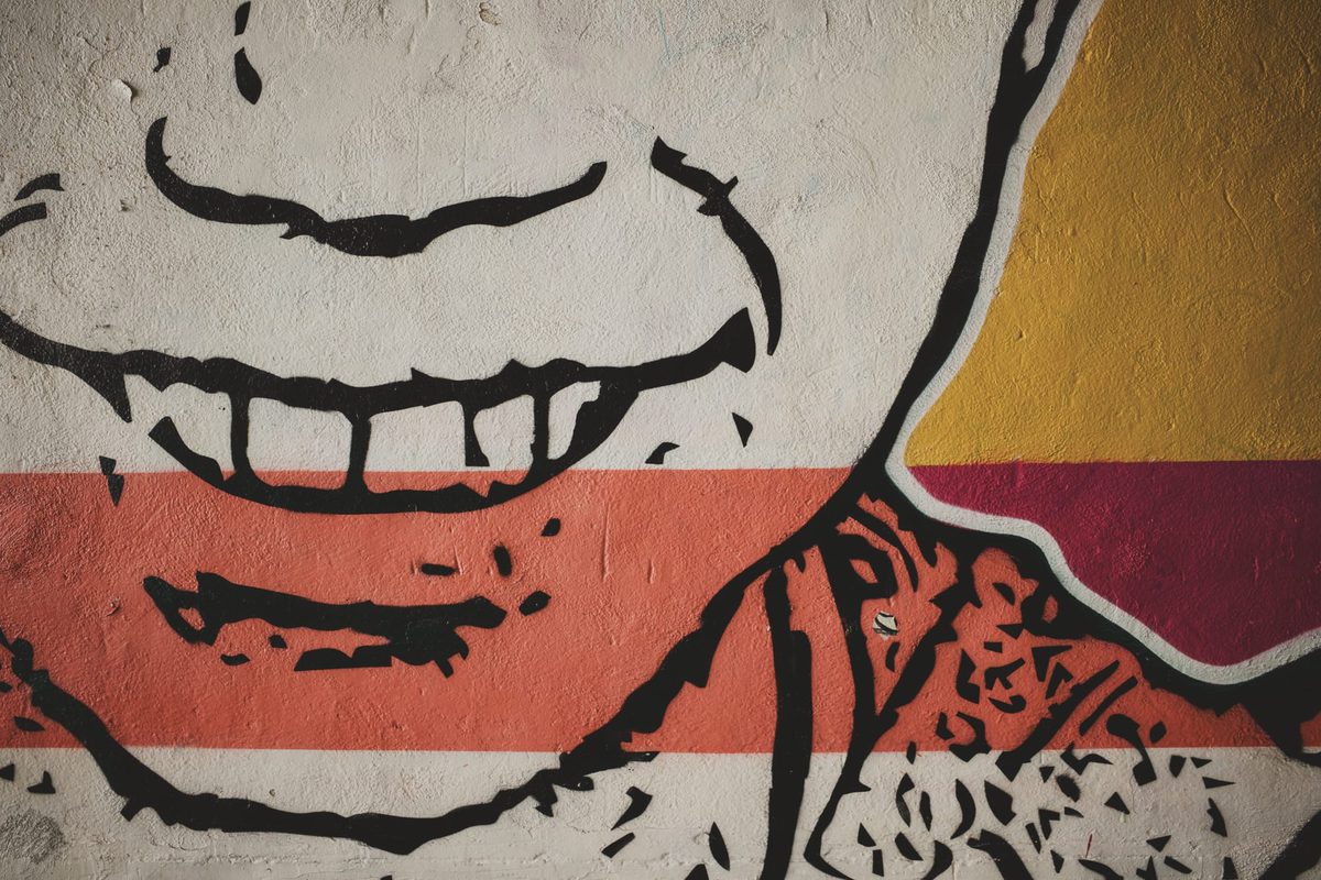 A mural of a smiling child. Image Anthony Nelzin-Santos.