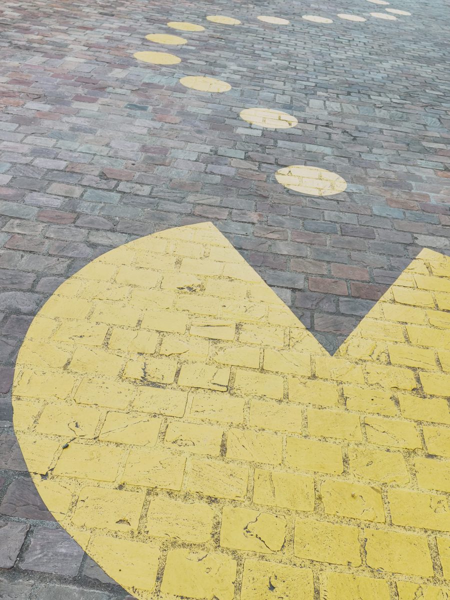 A painting of Pacman on the pavement.