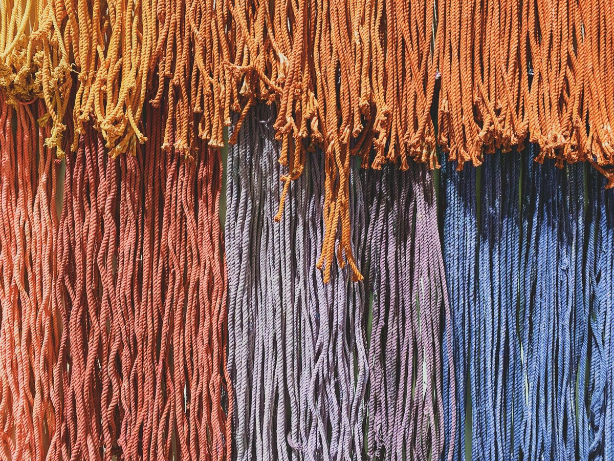 Hundreds of colourful threads in an art installation. Image Anthony Nelzin-Santos.