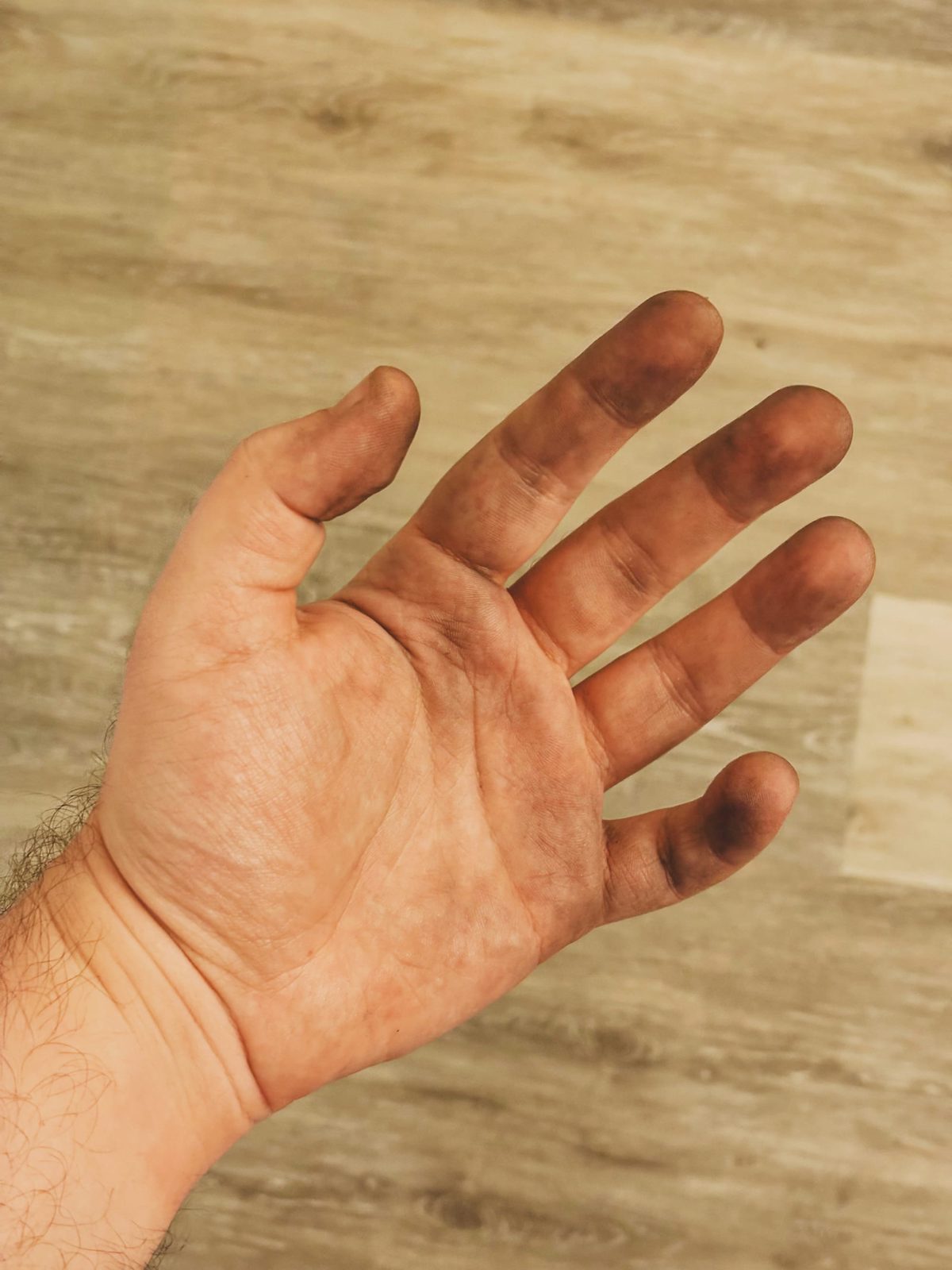 My hand covered with metal dust. Image Anthony Nelzin-Santos.