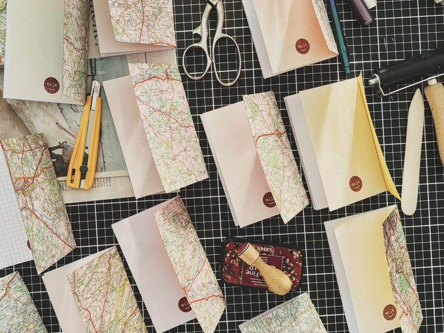 A batch of notebooks on a table.