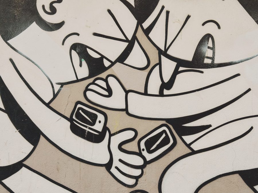 A mural of people bumping into each other because they were looking at their smartphone.
